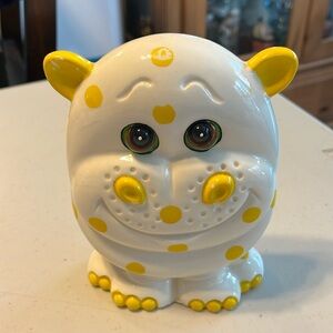 Vintage Hippo bank made in China. Has no stopper. Flat will sit against wall